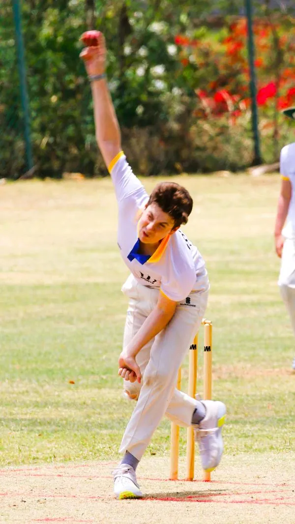 Junior fast bowler in his delivery stride